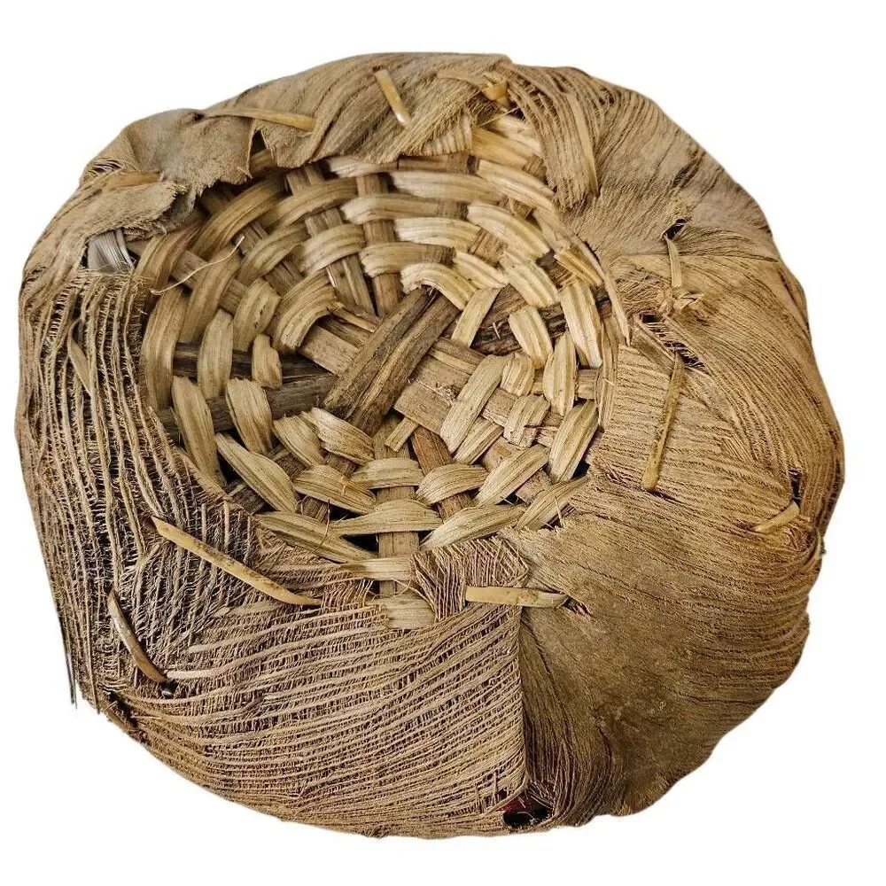 Primitive handmade basket, dried palm leaf woven.